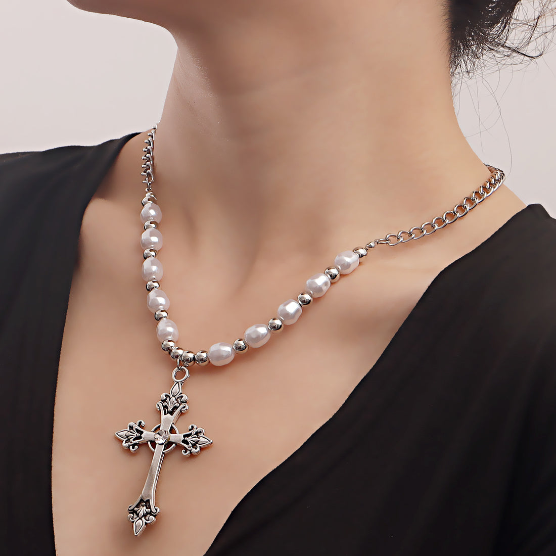 Pearl necklace paired with a cross pendant necklace, vintage-style cross necklace for women