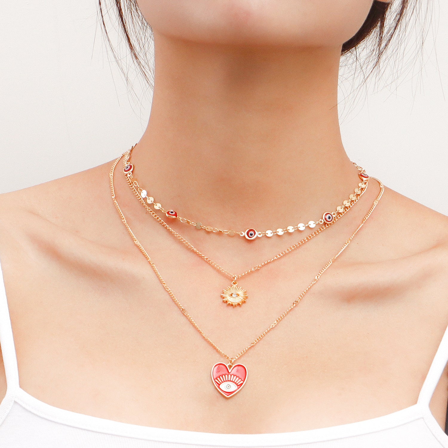 Heart Evil Eye Necklace, Multi-layer Necklace Set, featuring 3 different Evil Eye designs.