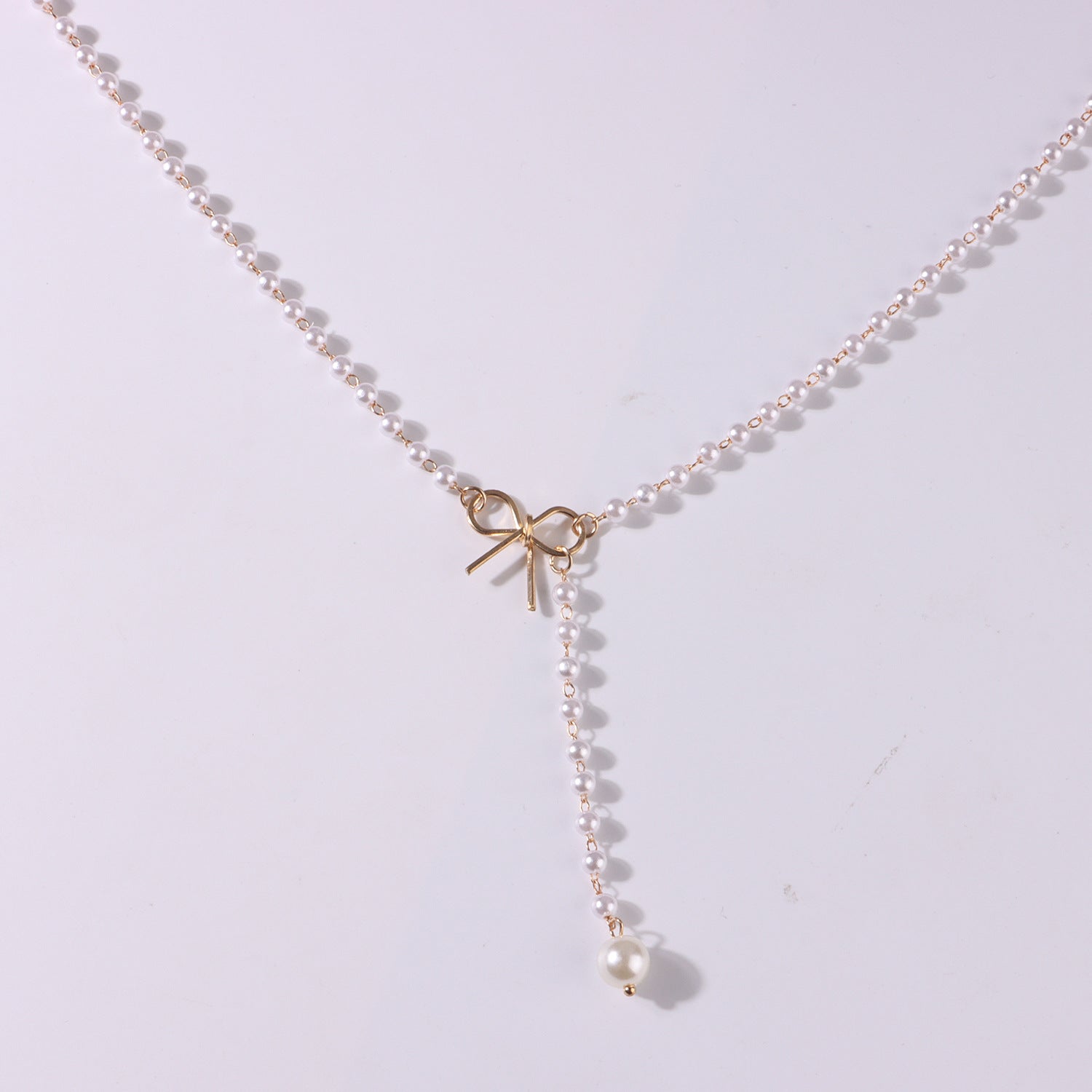 Gold-plated bow, pearl necklace, simple and stylish necklace