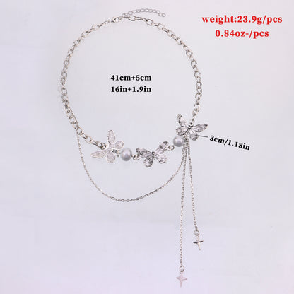 Butterfly necklace with luminous pearls and star tassel pendant